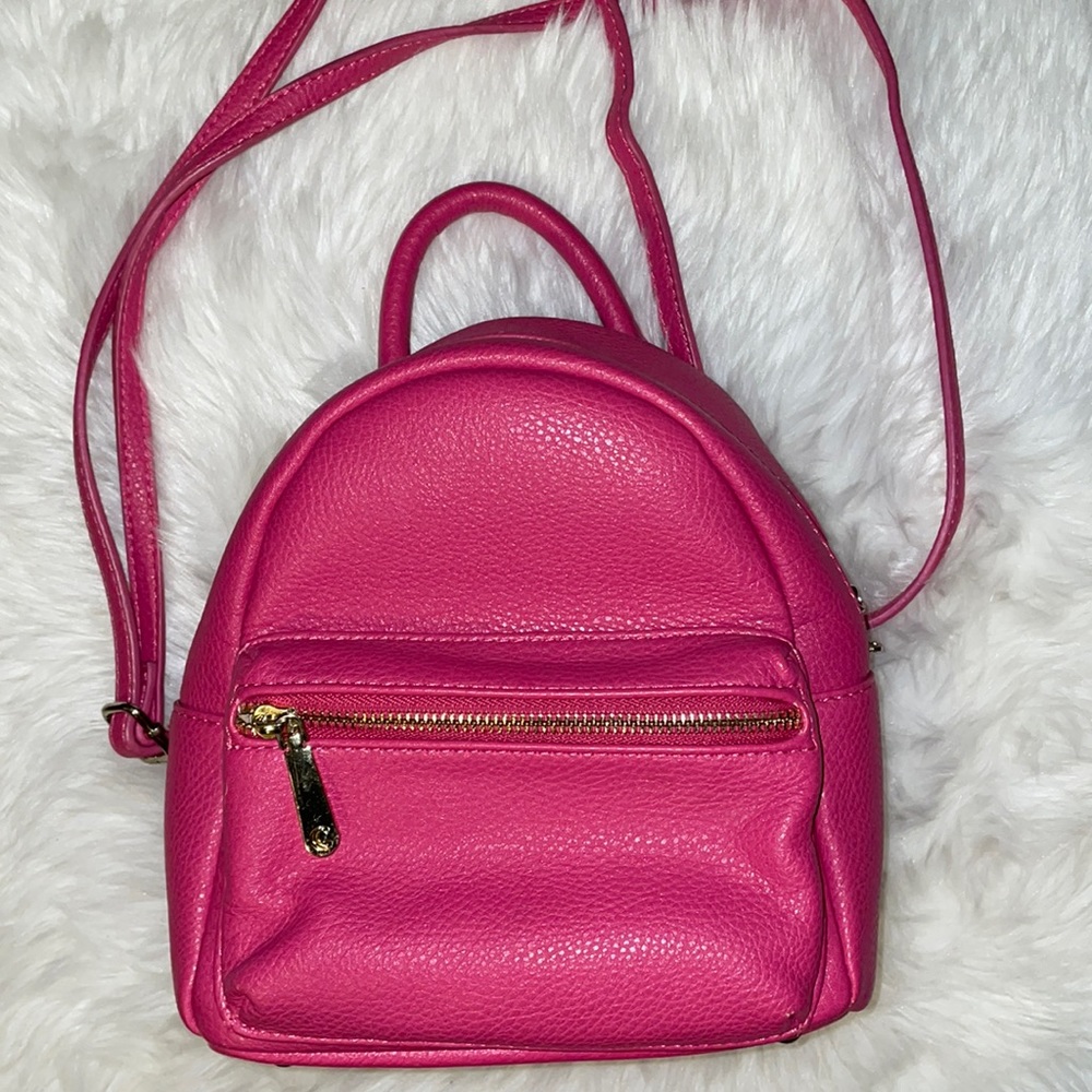 Adorable pink mini backpack from Charming Charlie. Like new- never used